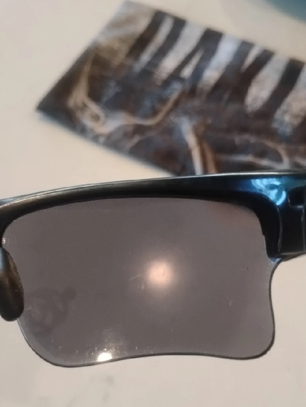 Oakley Black Frame Sunglasses with Gray And Orange Lenses